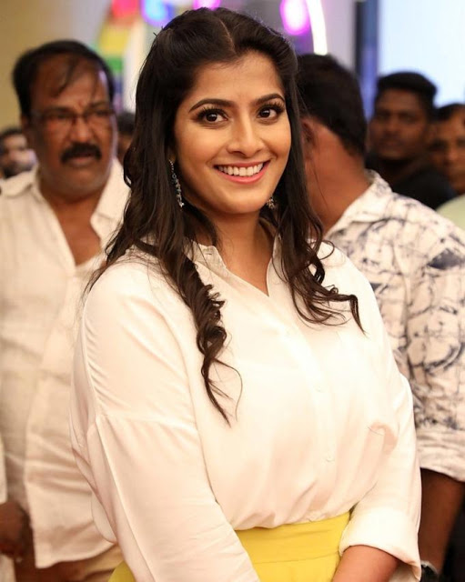 Varalaxmi Sarathkumar In White Top At Tamil Movie Celebrity Show 13
